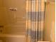 This bathroom features a shower/tub combo with a patterned curtain at 7664 Lincoln Trl, Plainfield, IN 46168