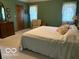 Calm bedroom with a large bed, a dresser and plenty of natural light at 7664 Lincoln Trl, Plainfield, IN 46168