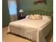 Bedroom with a bed and gold headboard, soft bedding, and natural light from the window at 7664 Lincoln Trl, Plainfield, IN 46168