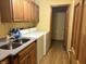 A laundry room with washer, dryer, sink, storage and access to a toilet room at 7664 Lincoln Trl, Plainfield, IN 46168