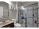 Cozy bathroom featuring a granite sink countertop, a toilet and glass door shower at 7736 Eagle Point Cir, Zionsville, IN 46077