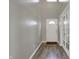 Bright entryway with wood-look flooring and white doors and trim at 7736 Eagle Point Cir, Zionsville, IN 46077