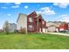 Spacious brick home with two-car garage, well-manicured lawn, and an arched entryway at 7736 Eagle Point Cir, Zionsville, IN 46077