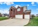 Brick home with a two-car garage, red shutters, and landscaped front yard at 7736 Eagle Point Cir, Zionsville, IN 46077