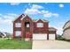 Charming two-story brick home with red shutters, arched entryway, and a two-car garage at 7736 Eagle Point Cir, Zionsville, IN 46077