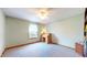 Bedroom with neutral walls, carpet, ceiling fan, window and an office desk at 8142 Bentley Farms Dr, Indianapolis, IN 46259