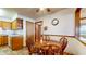 Cozy dining area with wood table and chairs, adjacent to kitchen, ideal for Gathering meals at 8142 Bentley Farms Dr, Indianapolis, IN 46259
