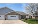 Charming brick home with lush landscaping and a two-car garage at 8142 Bentley Farms Dr, Indianapolis, IN 46259