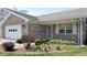 Charming home with beautiful flowering plants and a well-manicured lawn at 8142 Bentley Farms Dr, Indianapolis, IN 46259