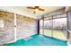 Enclosed sunroom boasting brick walls and views of the backyard, offering a cozy space for leisure at 8142 Bentley Farms Dr, Indianapolis, IN 46259
