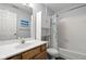The bathroom has a bathtub with a shower, a toilet, and a vanity at 8810 Yardley Ct # 208, Indianapolis, IN 46268