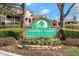 Yardley Court Condominiums entrance sign with manicured landscaping and decorative flowers at 8810 Yardley Ct # 208, Indianapolis, IN 46268