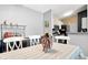 Bright dining area featuring a table with seating and access to the kitchen at 8810 Yardley Ct # 208, Indianapolis, IN 46268