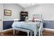 This dining room features a table with a bench and chairs, and a decorative shelf at 8810 Yardley Ct # 208, Indianapolis, IN 46268