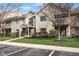 Inviting two-story condo featuring a well-maintained lawn and beautiful landscaping at 8810 Yardley Ct # 208, Indianapolis, IN 46268
