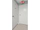 This hallway has white doors and an exit sign at 8810 Yardley Ct # 208, Indianapolis, IN 46268