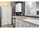 Modern kitchen featuring stainless steel appliances, white cabinets, and a sleek faucet at 8810 Yardley Ct # 208, Indianapolis, IN 46268
