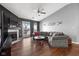 Cozy living room featuring a fireplace, vaulted ceiling, and a sliding glass door to a deck at 8810 Yardley Ct # 208, Indianapolis, IN 46268