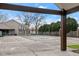 This is a pool area with a pool cover and a building in the background at 8810 Yardley Ct # 208, Indianapolis, IN 46268