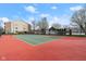 Outdoor tennis court on community property, with well-maintained surface and surrounding landscaping at 8810 Yardley Ct # 208, Indianapolis, IN 46268