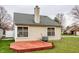 Back exterior angle showcasing the wood deck and green roof at 9223 Steeplechase Dr, Indianapolis, IN 46250