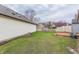 Spacious backyard showcasing a red wooden deck and lush green lawn at 9223 Steeplechase Dr, Indianapolis, IN 46250