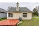Back exterior view of the home showing the wooden deck, window placement, and siding at 9223 Steeplechase Dr, Indianapolis, IN 46250