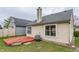 Rear exterior showcasing the wooden deck and design elements of the home at 9223 Steeplechase Dr, Indianapolis, IN 46250