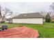 Large backyard featuring a red wooden deck and ample space for outdoor activities at 9223 Steeplechase Dr, Indianapolis, IN 46250