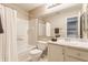Well-lit bathroom featuring a shower-tub combo, a bright vanity, and modern fixtures at 9223 Steeplechase Dr, Indianapolis, IN 46250