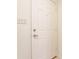 A close-up showcasing a six panel white door with a silver handle and switch plate at 9223 Steeplechase Dr, Indianapolis, IN 46250