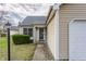 Well-maintained home showcasing an attached single car garage and neat front lawn at 9223 Steeplechase Dr, Indianapolis, IN 46250