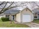 Charming single-story home featuring a clean exterior and attached single car garage at 9223 Steeplechase Dr, Indianapolis, IN 46250
