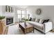 Bright living room featuring fireplace, large windows, and modern decor at 9223 Steeplechase Dr, Indianapolis, IN 46250