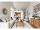 Spacious open-concept living room showcasing the kitchen and dining areas in the background at 9223 Steeplechase Dr, Indianapolis, IN 46250
