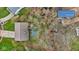 Aerial view showing approximate property lines, house, driveway, and surrounding greenery at 9448 Burrwood Cir, Indianapolis, IN 46235