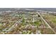 An aerial view of a residential area, featuring tree-lined streets and a mix of homes at 9448 Burrwood Cir, Indianapolis, IN 46235