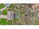 Aerial view of the house showing the roof, driveway and surrounding trees and neighborhood at 9448 Burrwood Cir, Indianapolis, IN 46235