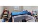 Bedroom with natural light, baby crib, and comfortable furnishings at 9448 Burrwood Cir, Indianapolis, IN 46235