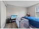 Bedroom with natural light, closet, and essential baby furniture including a crib at 9448 Burrwood Cir, Indianapolis, IN 46235