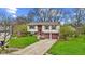 Charming two-story home with a well-maintained lawn, driveway, and two car garage at 9448 Burrwood Cir, Indianapolis, IN 46235
