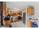 Functional kitchen with stainless steel appliances, tile backsplash, and ample cabinet space at 9448 Burrwood Cir, Indianapolis, IN 46235