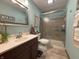 Updated bathroom featuring a modern vanity, mirror, shower with glass door, and tiled floor at 1066 Woodridge, Brownsburg, IN 46112