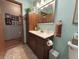 Bathroom with a vanity, mirror, and a toilet at 1066 Woodridge, Brownsburg, IN 46112
