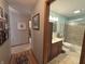 Bathroom with a sink, toilet, shower, and tiled floors at 1066 Woodridge, Brownsburg, IN 46112
