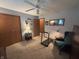 Cozy bedroom with patterned wallpaper, ceiling fan, carpeted floors, treadmill, and natural light at 1066 Woodridge, Brownsburg, IN 46112