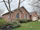 Charming brick home with well-manicured landscaping and attached garage at 1066 Woodridge, Brownsburg, IN 46112