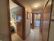 Hallway view showing access to laundry room at 1066 Woodridge, Brownsburg, IN 46112