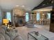 Spacious living room featuring a stone fireplace, comfortable seating, and an open layout at 1066 Woodridge, Brownsburg, IN 46112