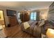 Comfortable main bedroom features a spacious layout, hardwood floors, and natural light at 1066 Woodridge, Brownsburg, IN 46112